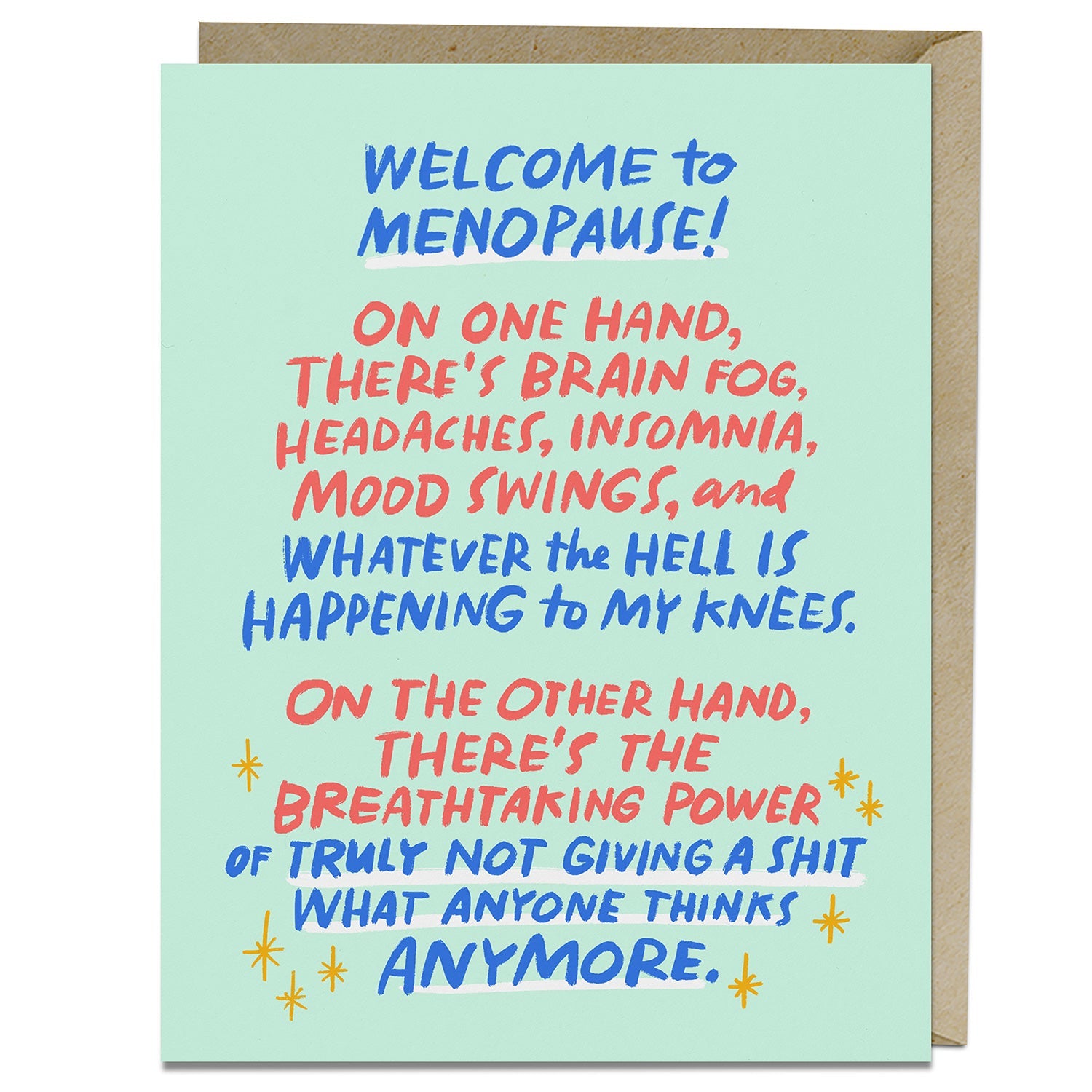 A greeting card that reads: "Welcome to menopause! On one hand, there’s brain fog, headaches, insomnia, mood swings, and whatever the hell is happening to my knees. On the other hand, there’s the breathtaking power of truly not giving a s*t what anyone thinks anymore." Behind the card is a brown craft envelope.