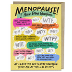 Em & Friends greeting card featuring the text 'I have some questions about this whole menopause thing...' in bold black letters on a white background with a colorful, abstract border in shades of pink, orange, and blue. The card is shown with a matching envelope.