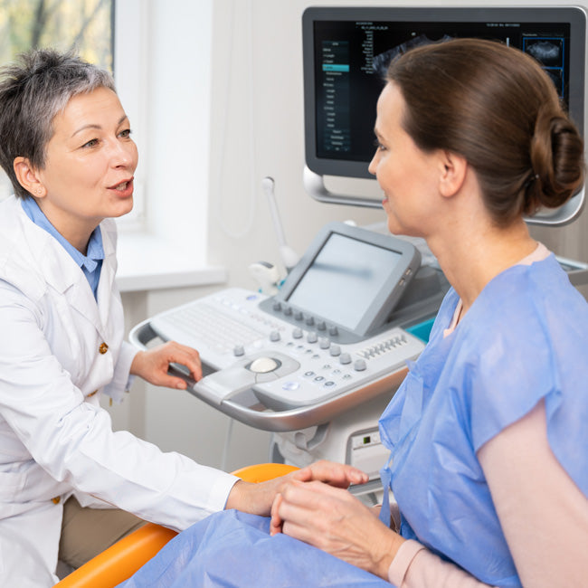 A doctor and patient converse during an appointment