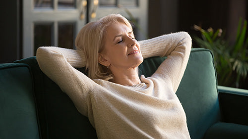 Middle Aged Woman Sleeping on Couch