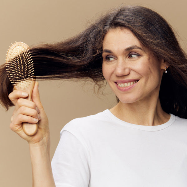 Woman Brushing Hair Out