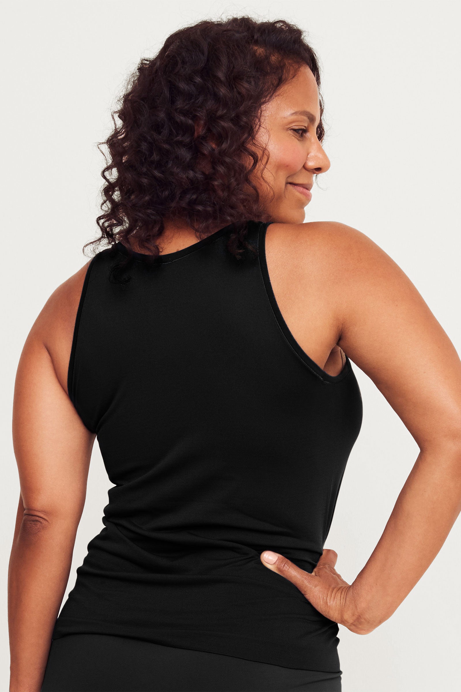 Anti-Flush Tank Top in black, back view on a white background. The image showcases the tank top's racerback design, offering both comfort and style for women seeking hot flash relief during perimenopause and menopause.