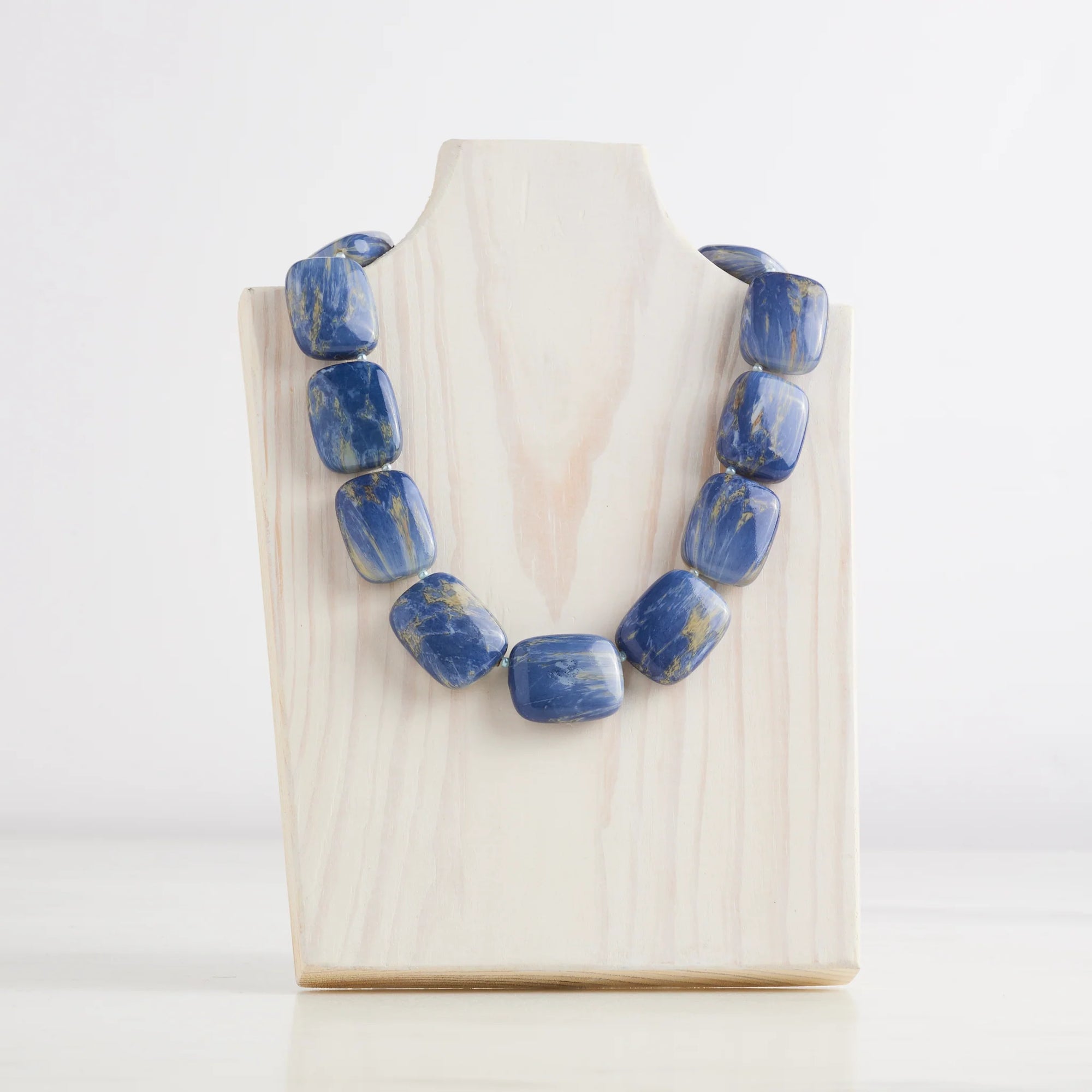 Chicklet Cooling Necklace in Blue color, offering stylish relief from hot flashes and night sweats. Equipped with freezable beads to regulate body temperature.