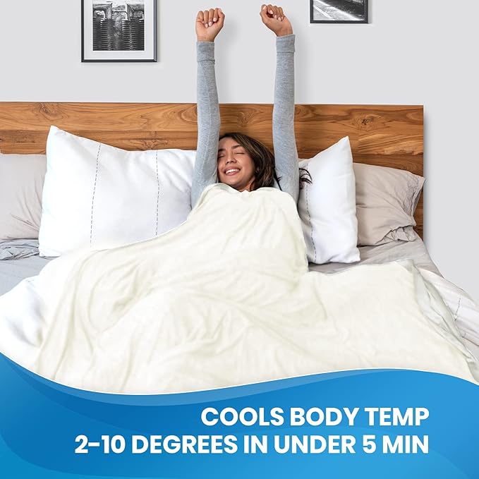 Woman using Cooling Blanket in bed, staying cool and dry to manage night sweats and improve sleep quality during menopause.