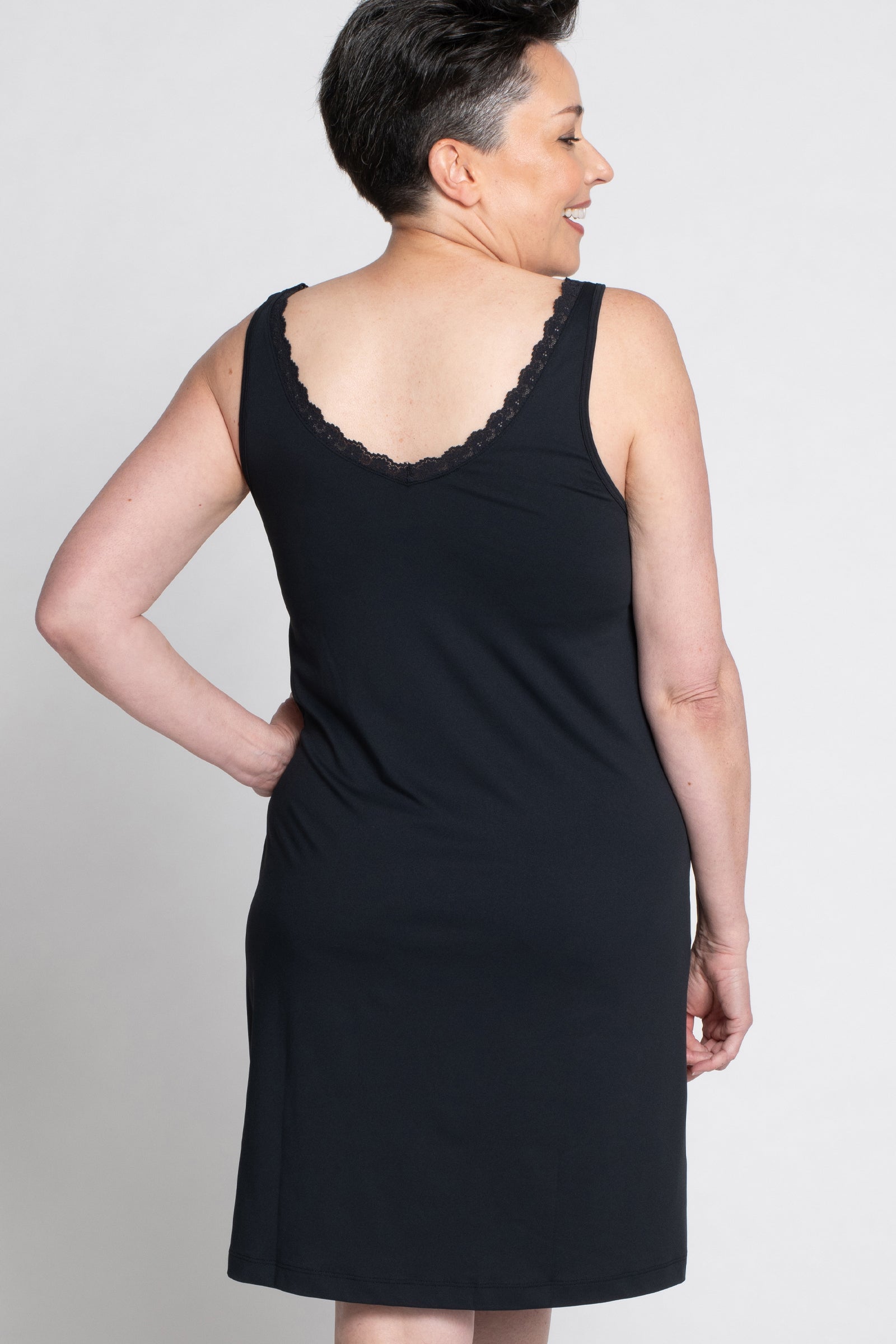 Lace Trim Anti-Flush Nightie in black color, back view on a white background. The image showcases the nightie's A-line silhouette and lace trim at the neckline and back, offering both comfort and style for women seeking hot flash relief during perimenopause and menopause.